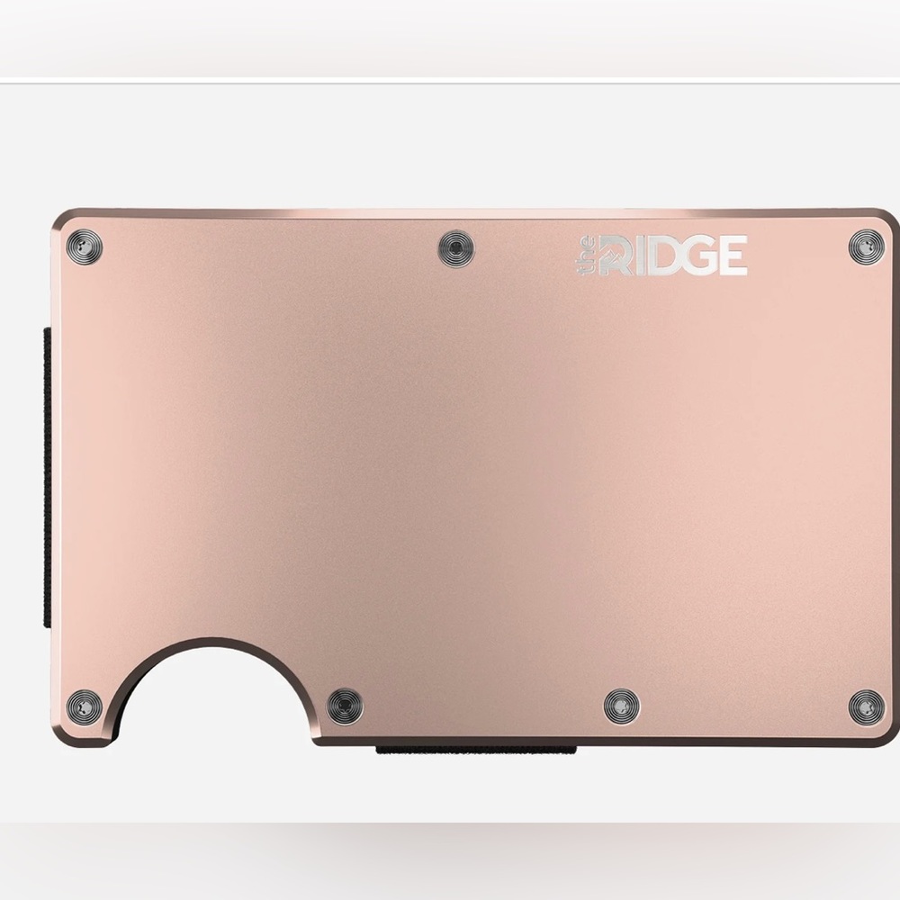 New in box (Still in plastic). The Ridge wallet with money clip. Rose Gold.